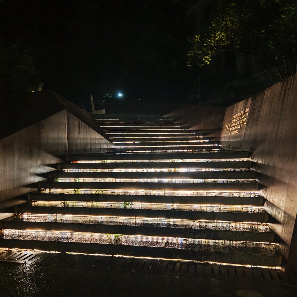Bad example of installing bare LED strip lights directly on outdoor concrete steps