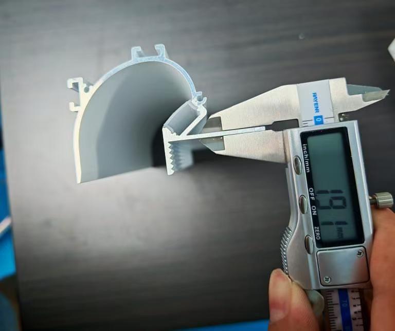 Measuring aluminum thickness of a plaster-in LED profile used for recessed architectural lighting installation